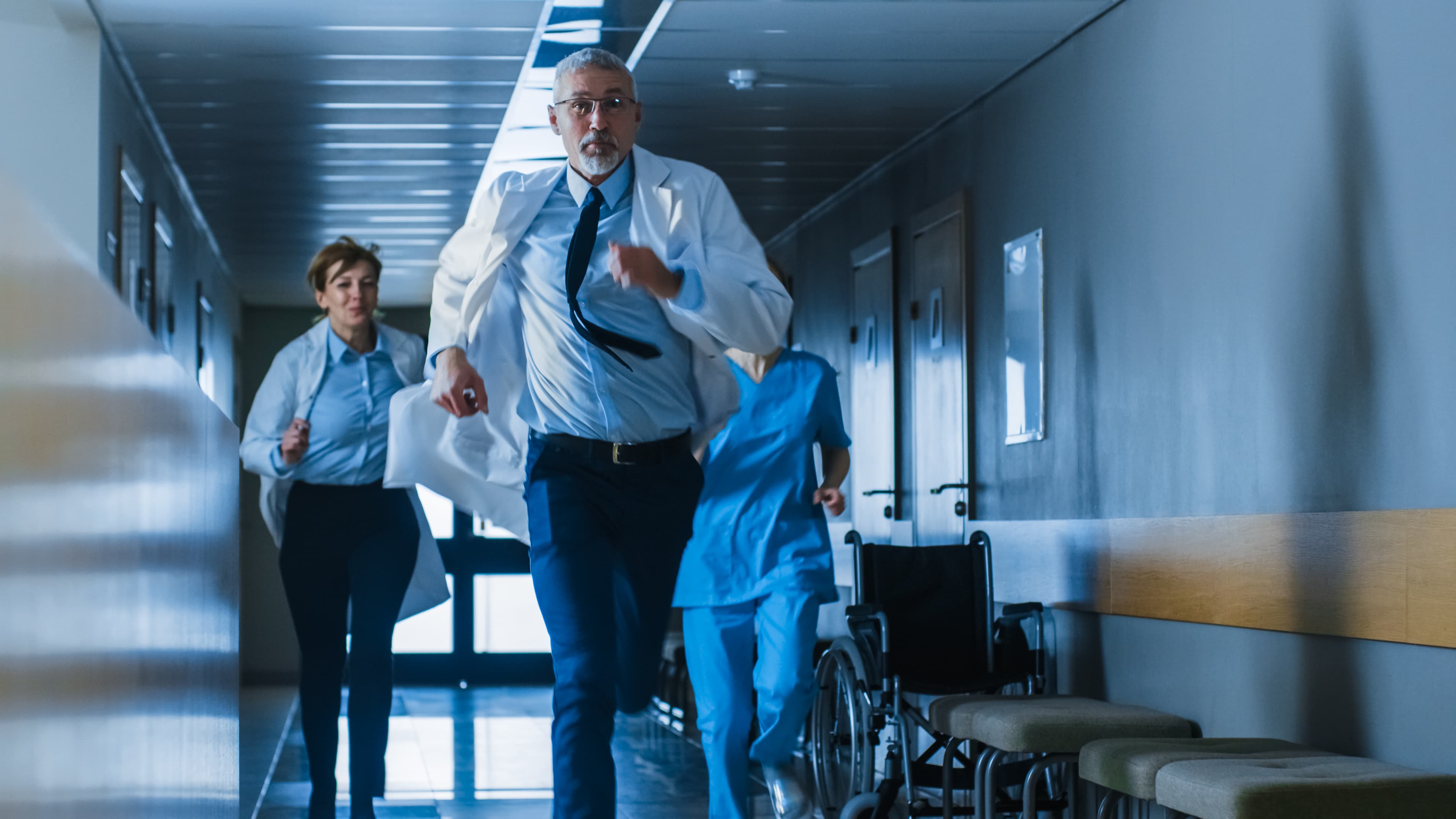 Emergency physician working a night shift in a busy hospital emergency department