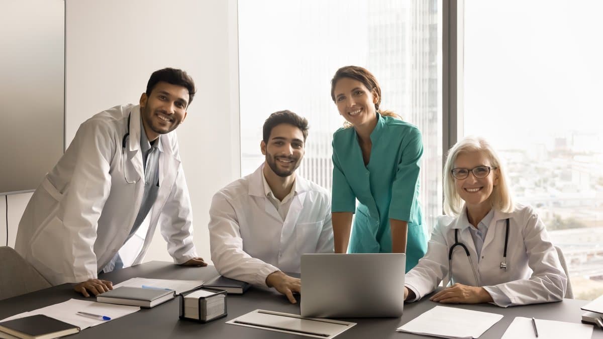 Confident healthcare team collaborating effectively after implementing well-designed scheduling rules