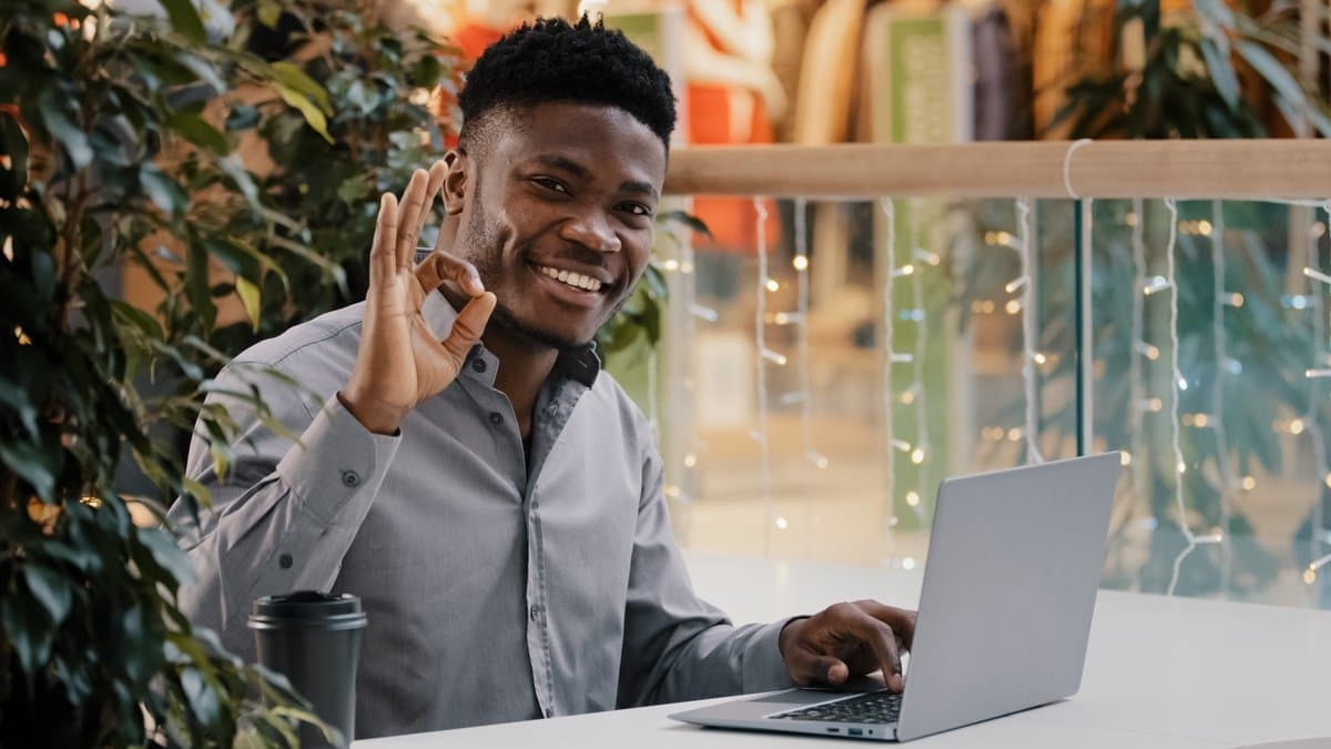 Confident healthcare administrator working at a modern computer with satisfaction