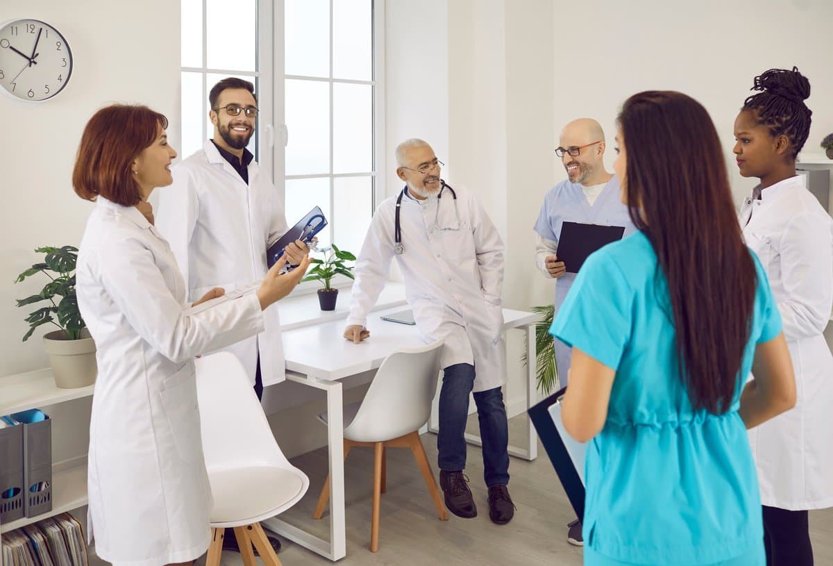 Healthcare team having transparent discussion about fair roster scheduling and shift distribution