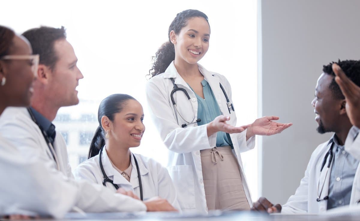 Team of professionals listening to each other respectfully in a collaborative meeting