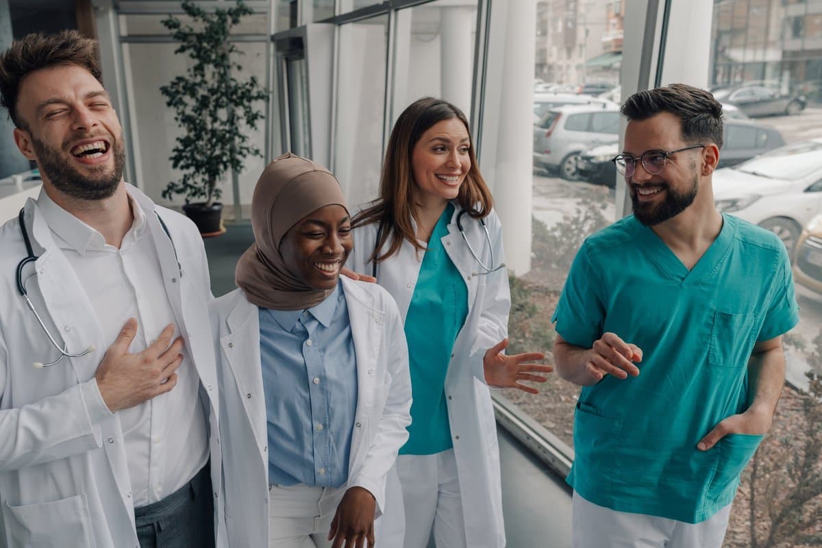 Healthcare team walking together in a relaxed positive moment